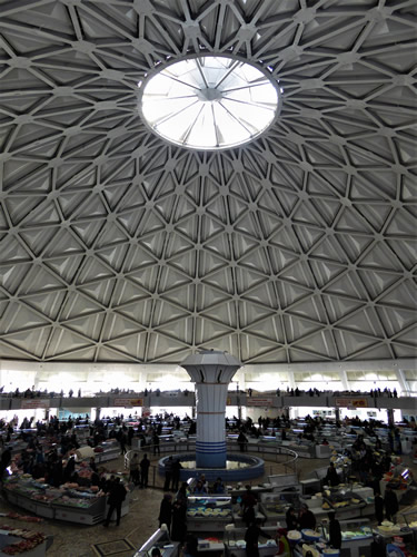 <strong>Chorsu Market, </strong>Tashkent, Uzbekistan.  Today’s bazaar is a complex of large blue and turquoise domes constructed by the government in the Soviet era during the 1980s on the site of former markets that have been in operation for over 2000 years.  See: <a href='http://uzbek-travel.com/about-uzbekistan/facts/chorsu-bazaar/'>http://uzbek-travel.com/about-uzbekistan/facts/chorsu-bazaar/</a>