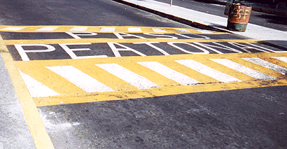 This pedestrian crosswalk provides level access to a bus island at an inter-modal transfer center in Mexico City.<br>Photo by T. Rickert, courtesy of DFID (UK) and TRL (UK).