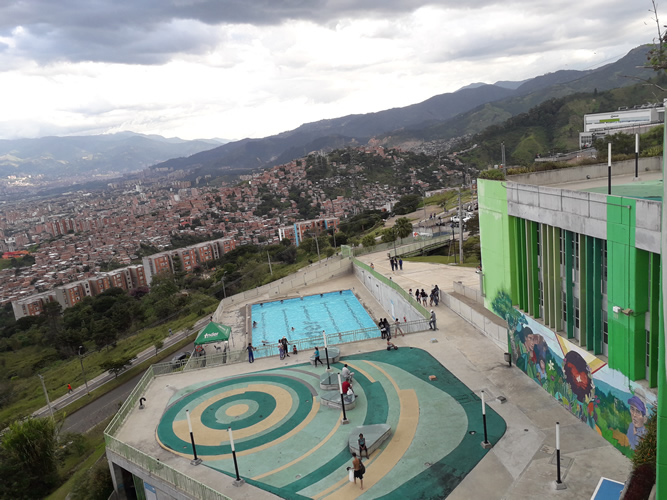 <strong>UVA Nuevo Occidente, </strong>Medellín, Colombia. Public and community spaces including swimming pool, dressing rooms, and recreational terrace; a ballroom, toy library, classroom workshop, cinema auditorium and children's playground; multiple classrooms, administrative offices, commercial premises and viewing terrace and, in addition to a multi-purpose Coliseum, synthetic court and urban gym. See also: <a href='https://www.lafargeholcimfoundation.org/media/news/projects/a-new-icon-of-community-empowerment-in-medellin-uva-de-la-imagin'>https://www.lafargeholcimfoundation.org/media/news/projects/a-new-icon-of-community-empowerment-in-medellin-uva-de-la-imagin</a>  (Photo: Benard Acellam)