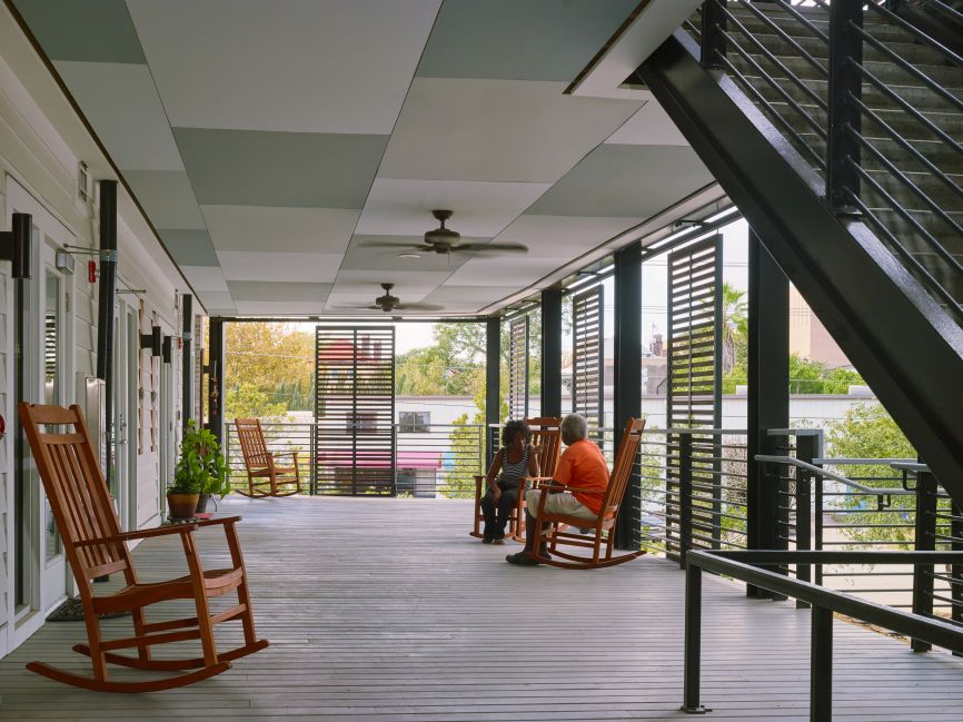 <p>Williams Terrace, Charleston, South Carolina, U.S.A., Architect of Record, McMillan Pazdan Smith Architecture, Spartanburg, South Carolina, U.S.A. /Design Architect, David Baker Architect, San Francisco, California, U.S.A., 2017. "Williams Terrace won the 2019 American Institute of Architects/Housing and Urban Development Secretary's Housing and Community Design Award for Excellence in Affordable Housing Design. This singular nation-wide award recognizes architecture that demonstrates overall excellence in terms of design in response to both the needs and constraints of affordable housing... Wide porches that double as circulation offer places to sit, meet in passing, and personalize a bit of outdoor space." (<a href='http://See: https://www.dbarchitect.com/project_detail/176/Williams%20Terrace%20.html'>See: https://www.dbarchitect.com/project_detail/176/Williams%20Terrace%20.html</a>) Photo credit: Chris Luker from DBArchitect.com.</p>
